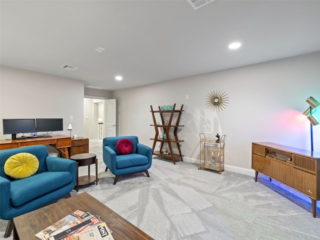 living area featuring light carpet, recessed lighting, visible vents, and baseboards