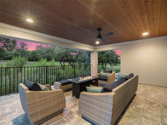 view of patio with an outdoor living space with a fire pit, ceiling fan, and fence