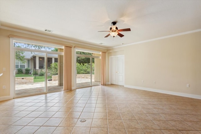 spare room featuring light tile patterned flooring, ornamental molding, ceiling fan, and a healthy amount of sunlight