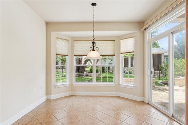 unfurnished dining area with light tile patterned floors