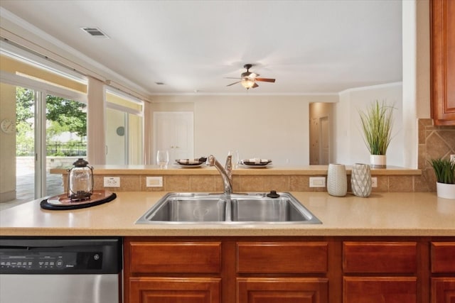 kitchen with stainless steel dishwasher, tasteful backsplash, ceiling fan, crown molding, and sink