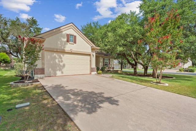 view of front facade featuring a garage and a front lawn