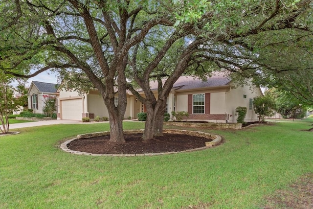 ranch-style home featuring a garage and a front yard