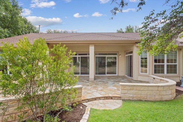 rear view of property with a patio area