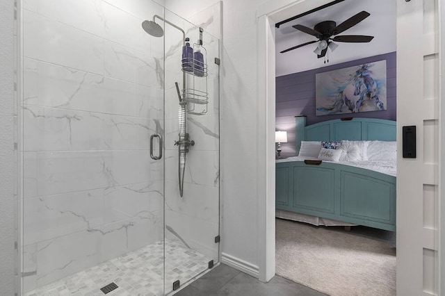 bathroom with tile patterned floors, a shower with door, and ceiling fan