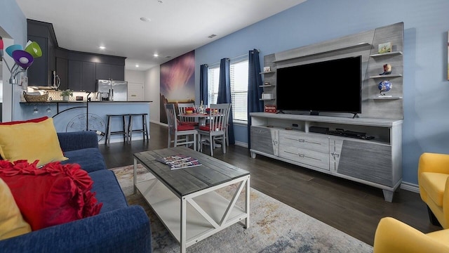 living room featuring dark wood-type flooring