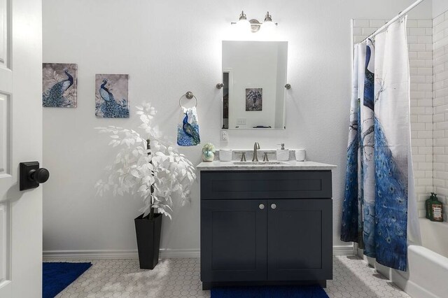 bathroom featuring vanity, tile patterned flooring, and shower / tub combo with curtain