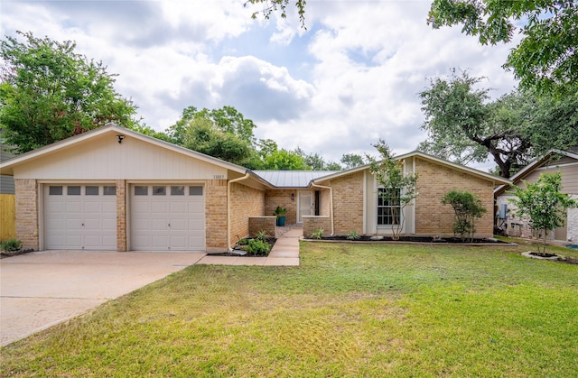 ranch-style house with a garage and a front yard