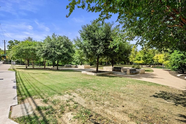 view of home's community featuring a lawn