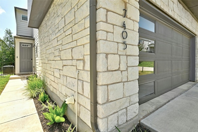 view of side of home featuring a garage