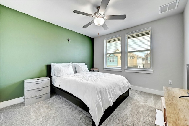 bedroom featuring light carpet and ceiling fan