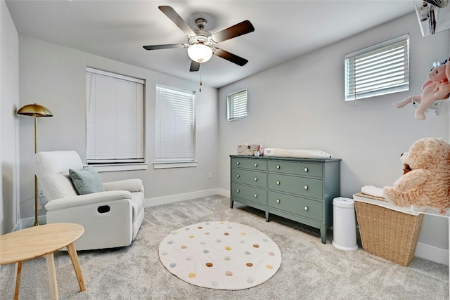 sitting room featuring ceiling fan and light colored carpet