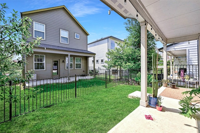 view of yard with covered porch