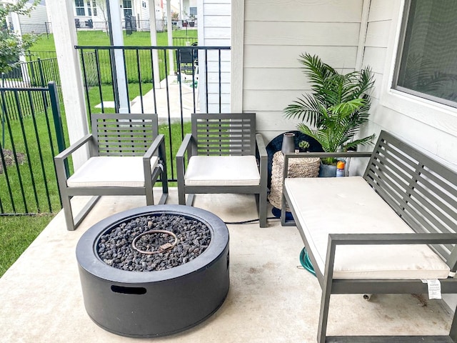 balcony with a patio and a fire pit