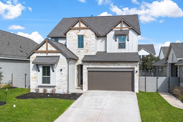 view of front of house with a front yard and a garage