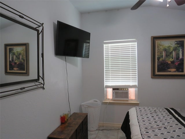 tiled bedroom with cooling unit, ceiling fan, and vaulted ceiling