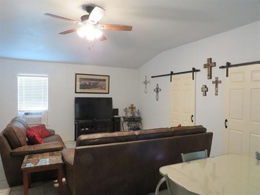 living room with a barn door, cooling unit, lofted ceiling, and ceiling fan