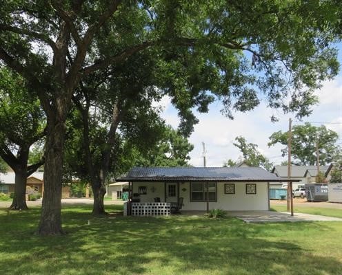 ranch-style house with a front lawn