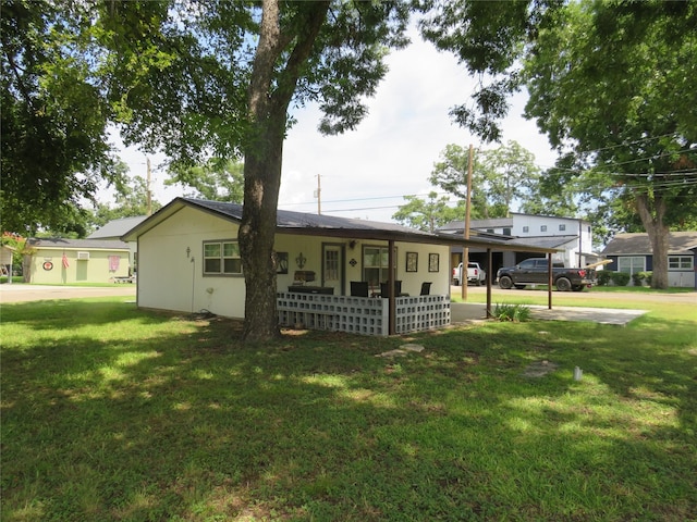 ranch-style home with a carport and a front yard