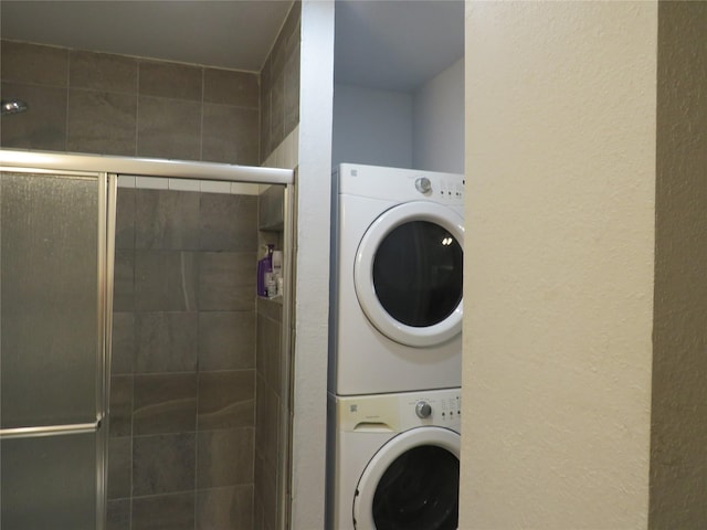 laundry room with stacked washer / drying machine