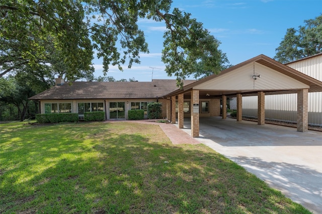 single story home with a carport and a front lawn