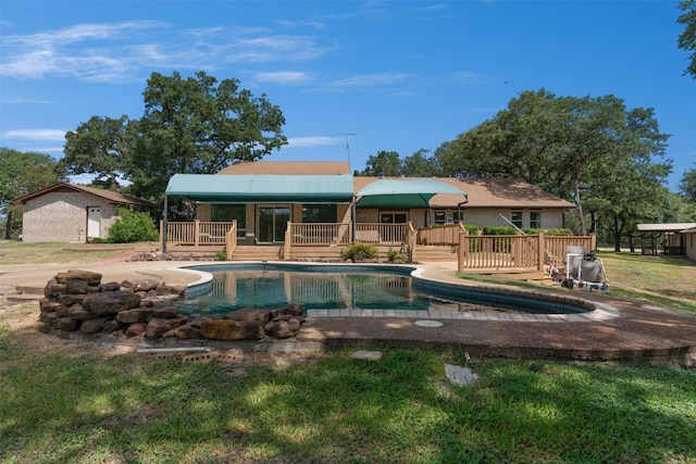 view of swimming pool with a wooden deck