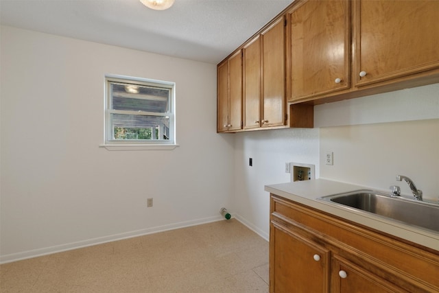 laundry room with hookup for a washing machine, light tile patterned flooring, sink, and cabinets