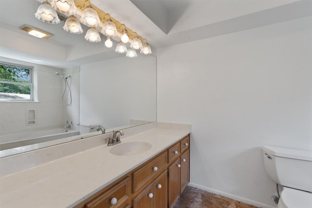 full bathroom with tile patterned floors, vanity, tiled shower / bath combo, and toilet