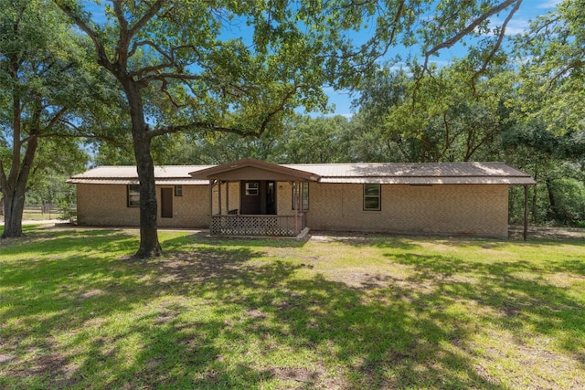 rear view of house with a lawn