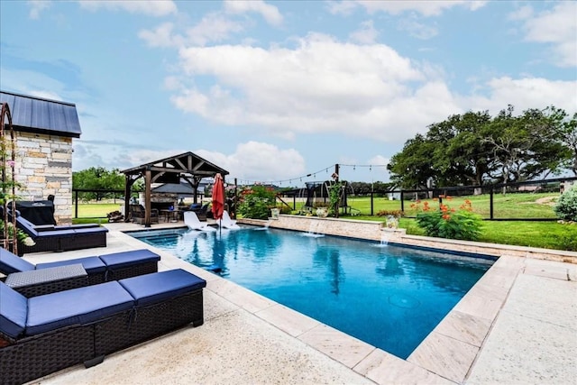 view of swimming pool featuring pool water feature, an outdoor living space, a gazebo, a yard, and a patio