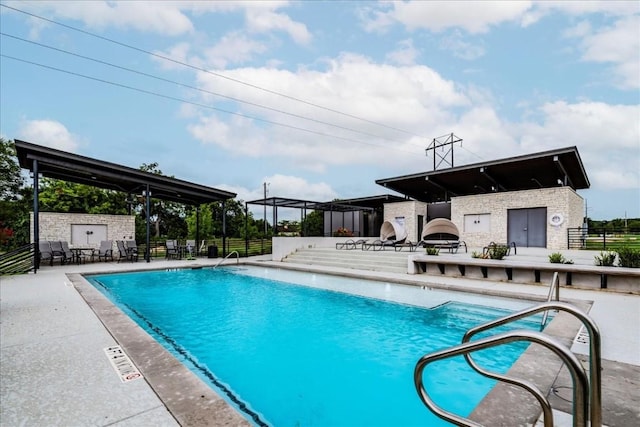 view of swimming pool with a patio