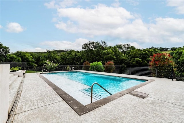 view of pool with a patio area