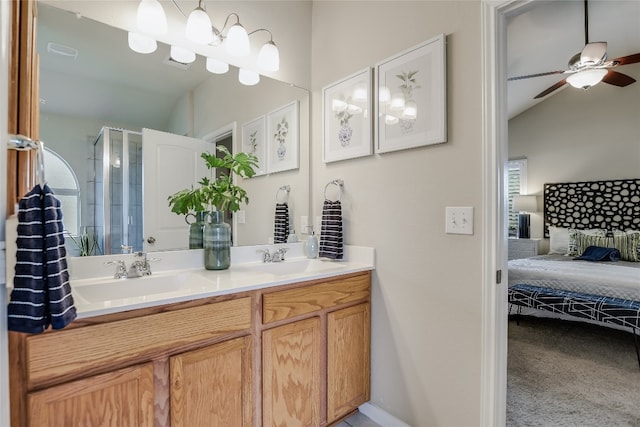 bathroom featuring vanity, walk in shower, ceiling fan, and vaulted ceiling