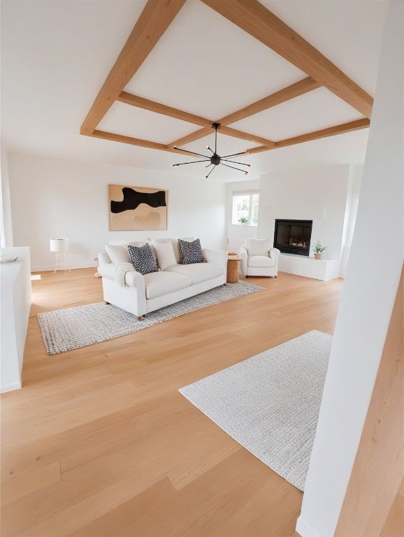 living room with light hardwood / wood-style flooring and ceiling fan