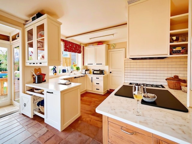 kitchen featuring tile patterned floors, tasteful backsplash, and plenty of natural light