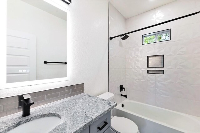 314 Saxon Ln, Austin, TX 78741 - full bathroom featuring decorative backsplash, vanity, and washtub / shower combination
