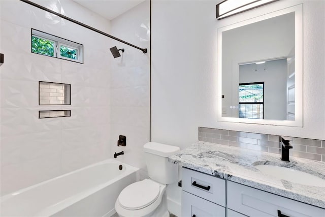 314 Saxon Ln, Austin, TX 78741 - bathroom with vanity, shower / washtub combination, and backsplash