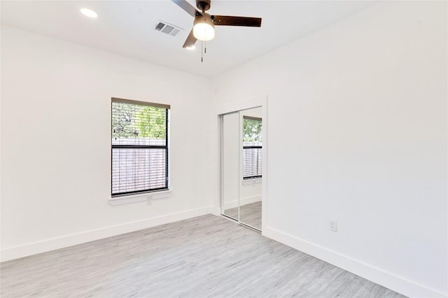 314 Saxon Ln, Austin, TX 78741 - unfurnished room featuring light wood-style flooring, a ceiling fan, and recessed lighting