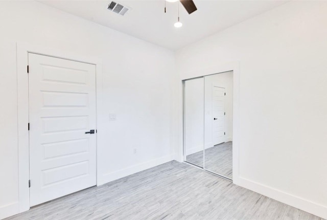 314 Saxon Ln, Austin, TX 78741 - unfurnished bedroom featuring light wood finished floors, a closet, and a ceiling fan