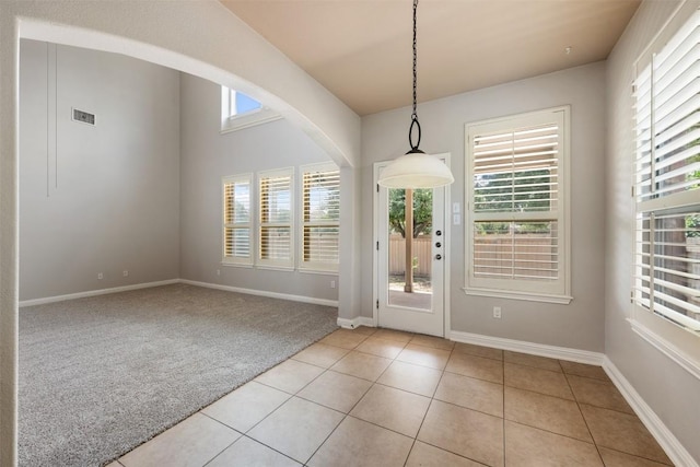 entryway featuring light carpet