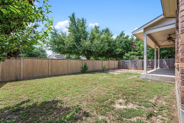 view of yard with a patio and ceiling fan