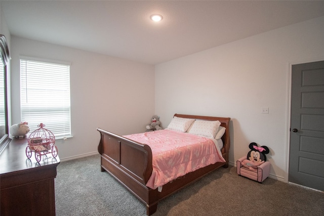 bedroom with dark colored carpet