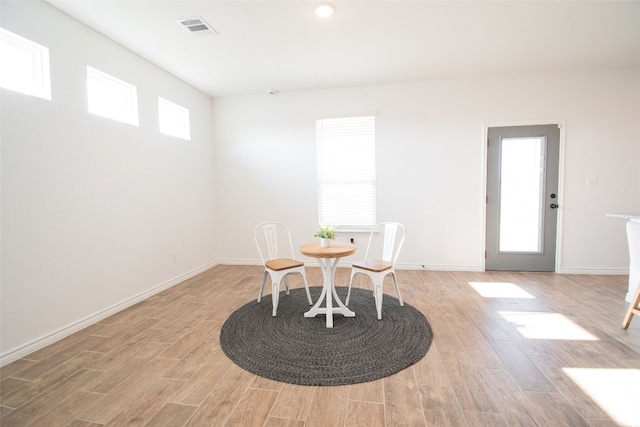 dining area with light hardwood / wood-style floors