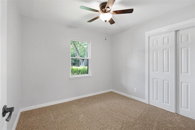 1505 Old Marion Rd, New Braunfels, TX 78130 - unfurnished bedroom with a closet, a ceiling fan, baseboards, and carpet