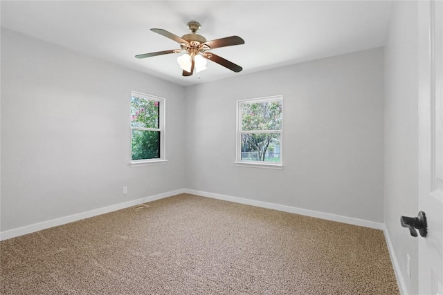 1505 Old Marion Rd, New Braunfels, TX 78130 - empty room with plenty of natural light, baseboards, carpet flooring, and a ceiling fan