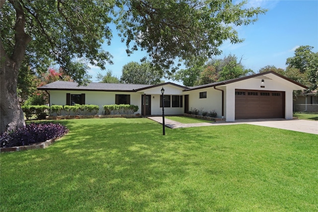 single story home with driveway, an attached garage, stucco siding, and a front yard