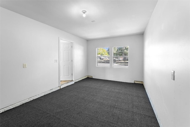 4515 Blue Meadow Dr, Austin, TX 78744 - spare room featuring dark colored carpet