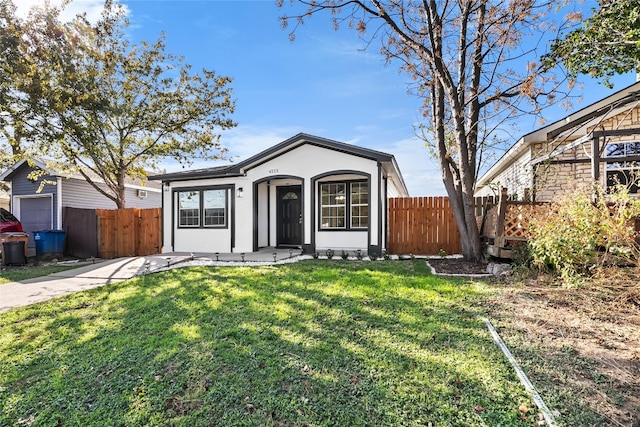 single story home with a front yard