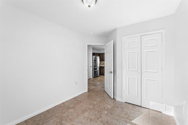 4515 Blue Meadow Dr, Austin, TX 78744 - unfurnished bedroom featuring stainless steel fridge with ice dispenser and a closet
