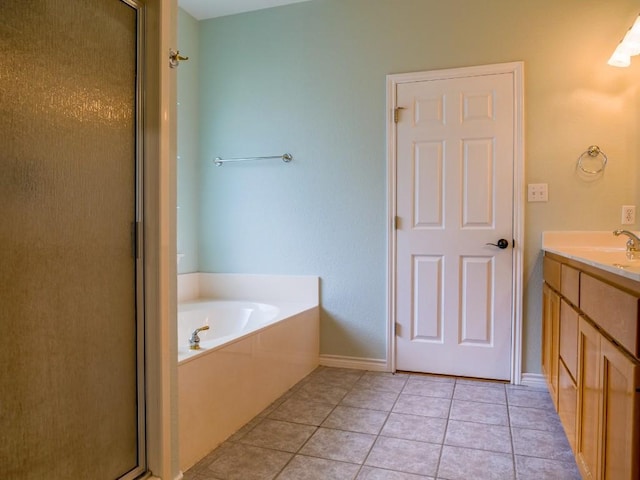 bathroom with a garden tub, vanity, tile patterned floors, and a shower stall